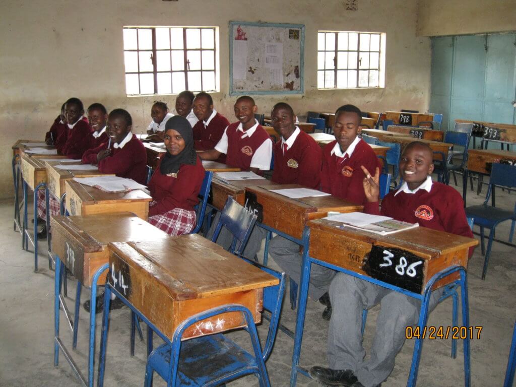 students sitting in a classroom in Kenya