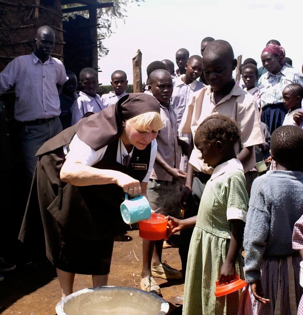 Sr. Kateri feeding the hungry children in Kenya