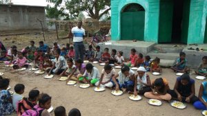 Quenching the hungry - Mealtime for the children in Orissa, India