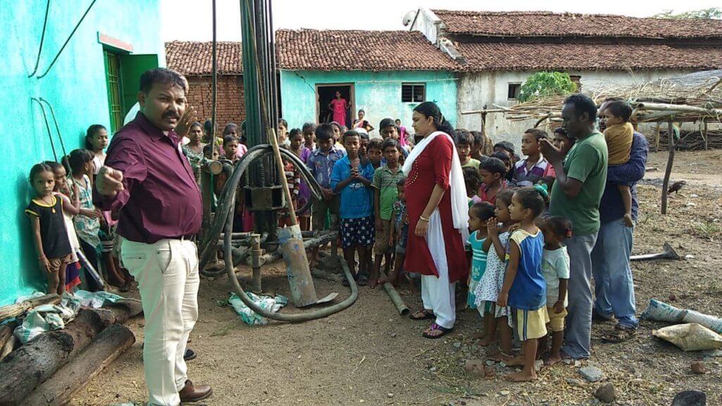 EC Children Watching the drill and waiting for water