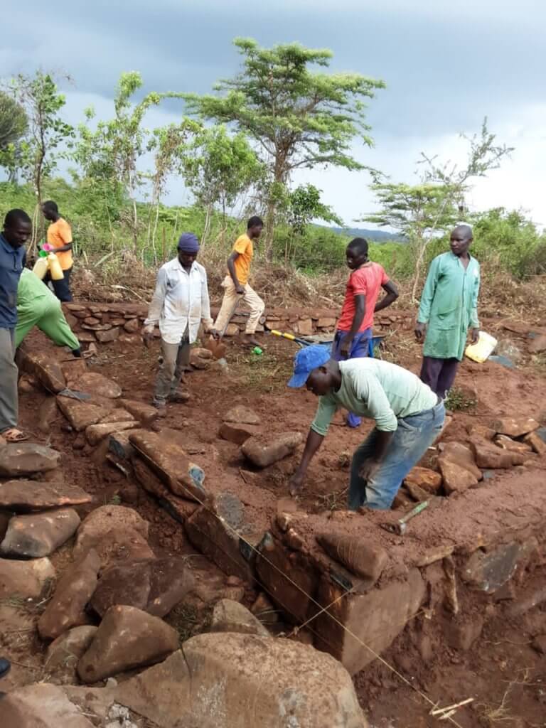 A Fresh Start: workers in Kenya building a foundation for a classroom