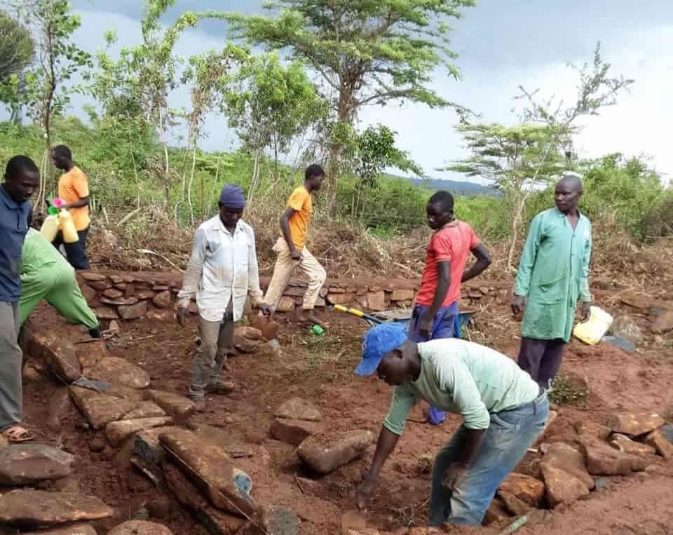 A Fresh Start: workers in Kenya building a foundation for a classroom