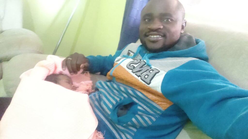 An update to the story: Simon with his infant girl